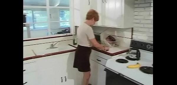  Younger guy gets blown by 70 year old redhead in kitchen